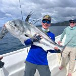 angler holding huge roosterfish